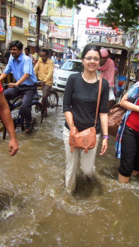 Kim walking ankle-deep though flood water.