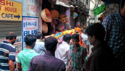 Body being carried though the streets