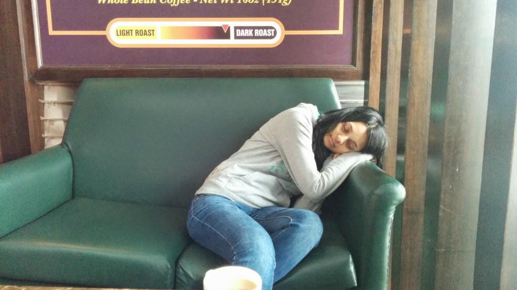 Kim exhausted from all flight delays, taking a nap in New Delhi Airport